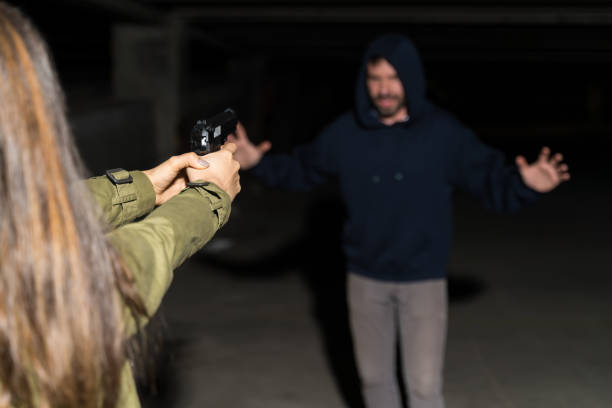 istock Female Victim Protecting Herself From Thief 1207365293