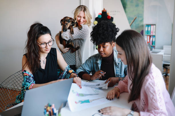 istock Women working in the office with a dog 1207365346