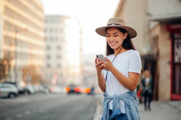 istock Charming Asian woman calling for uber 1207367817