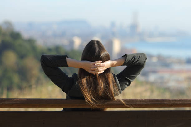 istock Executive relaxing sitting on a bench outdoors 1207374348