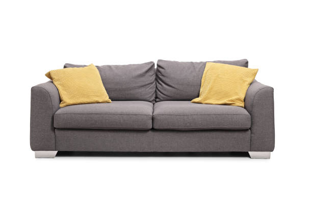 istock Studio shot of a gray sofa with yellow cushions 1207374744