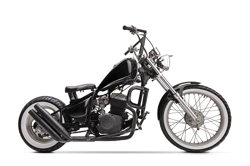 Studio shot of a black custom motorbike isolated on white background