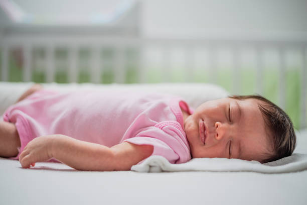 istock Sleeping newborn baby girl 1207382178