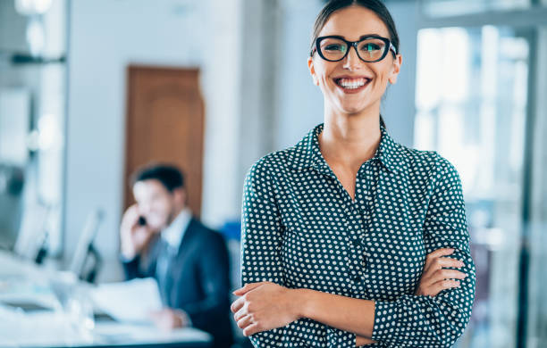 istock Smiling businesswoman at work. 1207382429