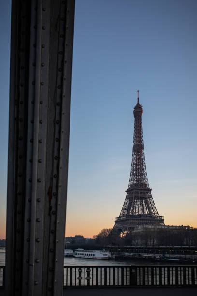 istock Sunset on the Eiffel Tower seen from the Pont de Bir Hakim in Paris. 1207383657