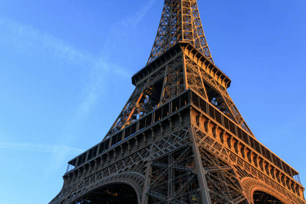 istock Sunrise hits the Eiffel Tower in Paris, France. 1207383671