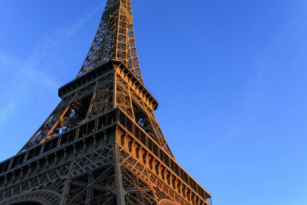 istock Sunrise hits the Eiffel Tower in Paris, France. 1207383676