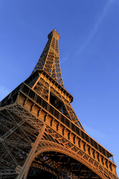 istock Sunrise hits the Eiffel Tower in Paris, France. 1207383678