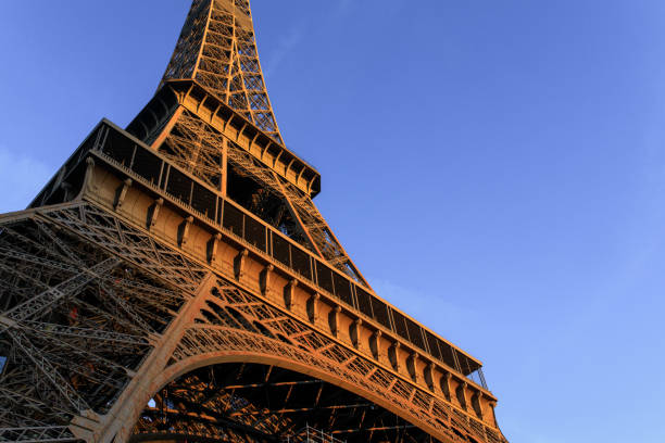 istock Sunrise hits the Eiffel Tower in Paris, France. 1207383684