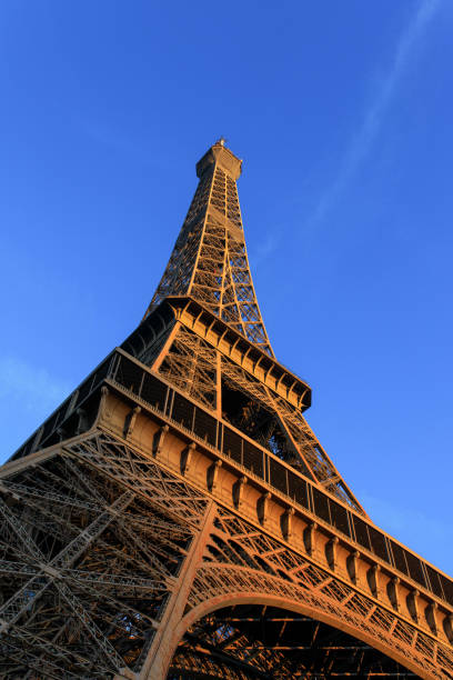 istock Sunrise hits the Eiffel Tower in Paris, France. 1207383686