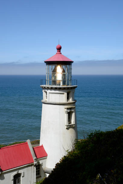 istock Heceta Head Lighthouse on a sunny day with pacific ocean background. 1207384249