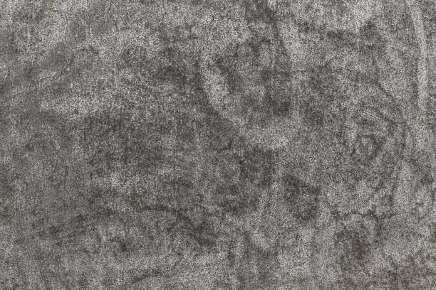 istock Textured surface of old gray concrete wall for background. 1207386095