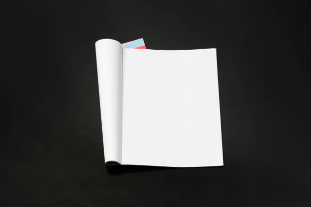 istock Mock-up magazine, newspaper or catalog isolated on black background. 1207387096