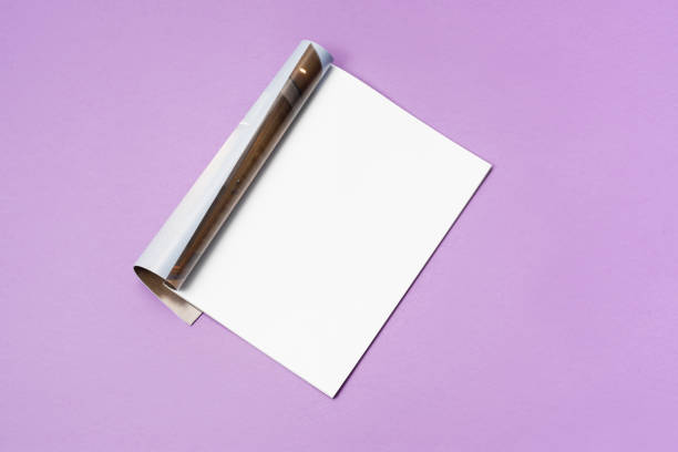 istock Mock-up magazine, newspaper or catalog isolated on purple background. 1207387321
