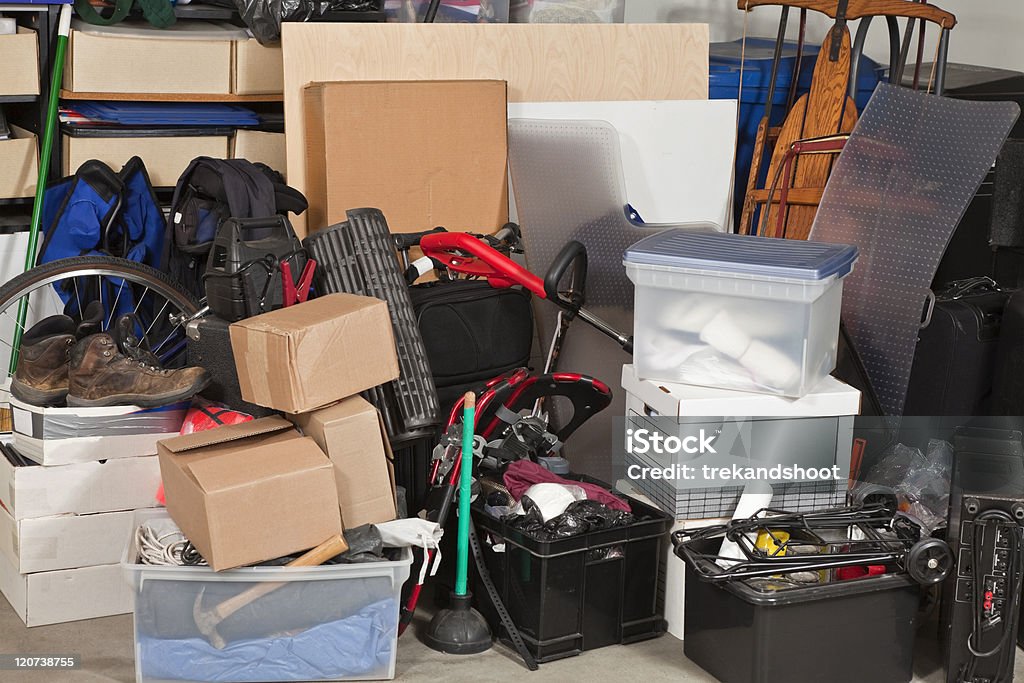Garage Storage Pile of boxes junk inside a residential garage. Messy Stock Photo