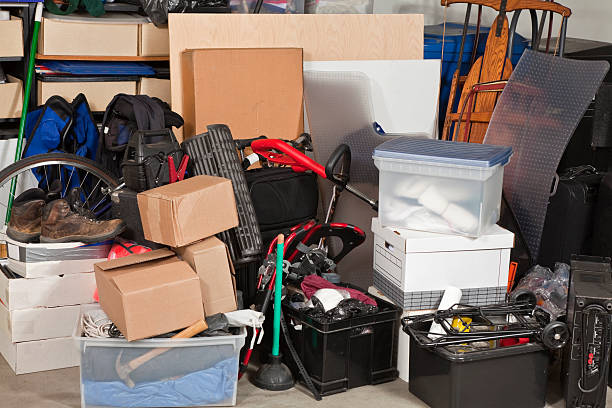 Garage Storage Pile of boxes junk inside a residential garage. obsolescence stock pictures, royalty-free photos & images