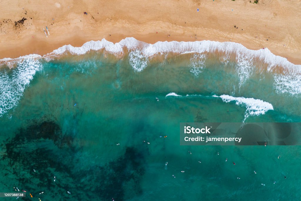 Surfers in big ocean waves, Sydney Australia by drone top down view Australia Stock Photo