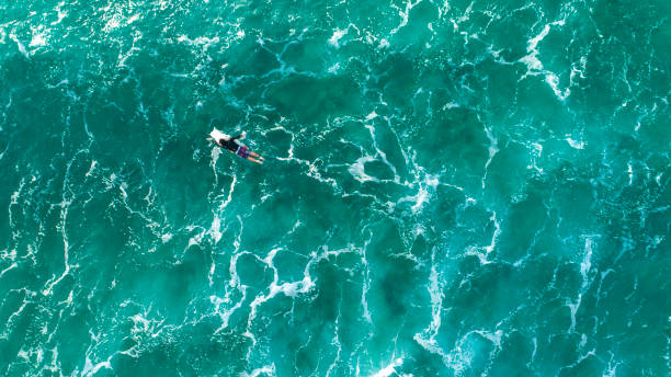 istock Surfers in big ocean waves, Sydney Australia by drone top down view 1207388143
