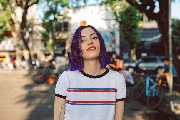Portrait of a young woman in Palermo, Buenos Aires Young hip woman standing in the street and posing, Buenos Aires, Argentina. purple hair stock pictures, royalty-free photos & images