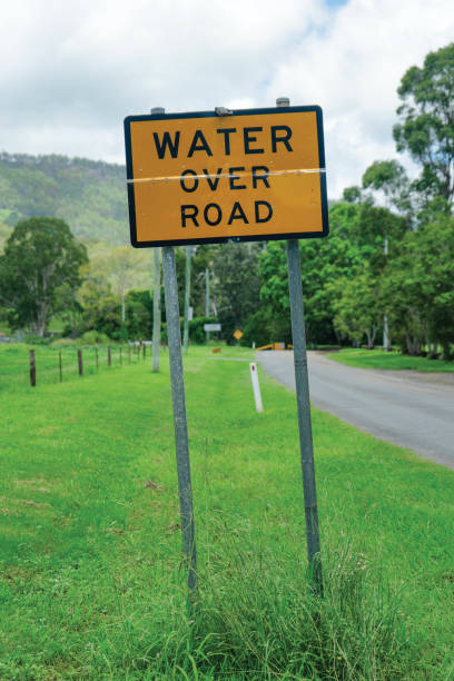 istock Water over road sign 1207391041