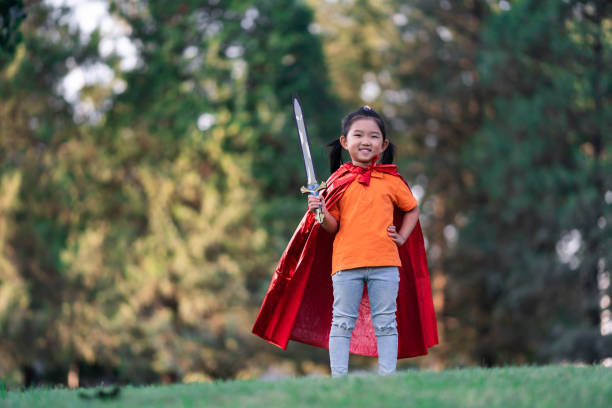 istock Wonder Girl Holding a Sword 1207391860