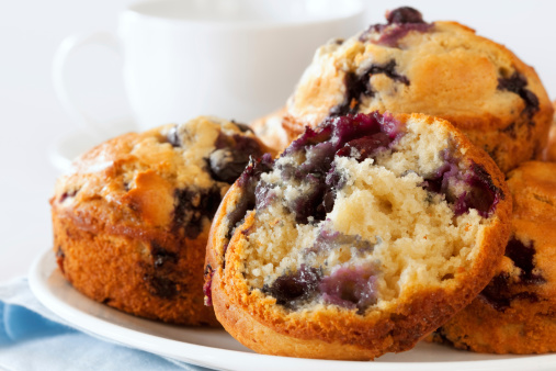 Plate of fresh blueberry muffins.  Soft focus.  More delicious desserts:   http://robynm.smugmug.com/photos/269756322_QZdYd-L.jpg