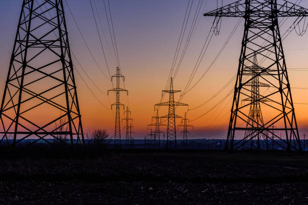 istock High voltage power line in a field at sunset 1207400225
