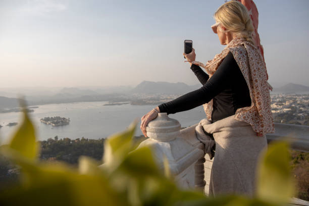 istock Mature woman looks off to view from hillside 1207401152