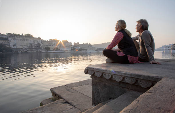 istock Mature couple explores a ghat at sunrise 1207401266