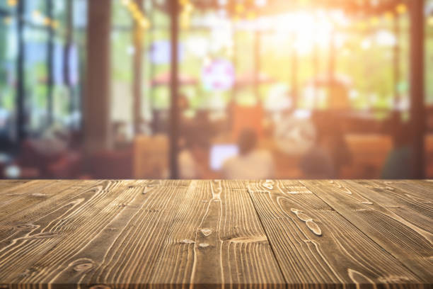 istock Wooden board or table and abstract blurred background. Free space can be used for photo montage or product display design and advertising 1207404263