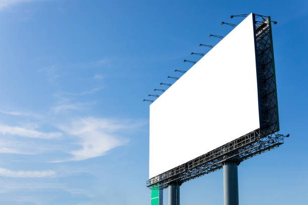 istock Empty large white advertising billboard on top of the building 1207408579
