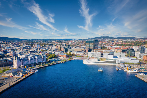 Aerial Drone View over Oslo Harbor Cityscape and Harbor Waterfront under a beautiful summer Sky. Oslo, Norway, Scandinavia
