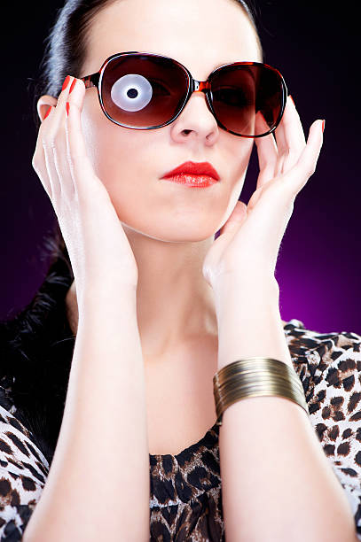 Beautiful elegant young woman with sunglasses stock photo