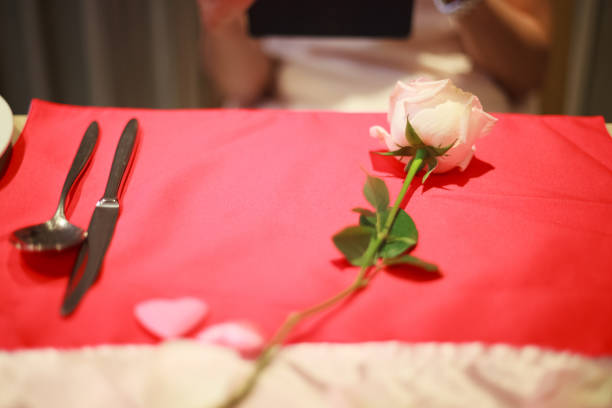 istock Romantic luxurious lunch or dinner on dining table, dating with wife or girlfriend, anniversary surprise meal with blurred woman background. Celebration, Romance, Valentine's Day and Love concept. 1207414736