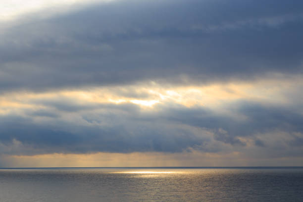 istock Bright cumulus clouds against the blue sky. Sunset sky Natural background. seascape 1207417701