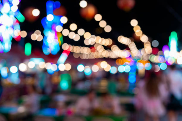 istock Colourful defocused lights at a local night market 1207418259