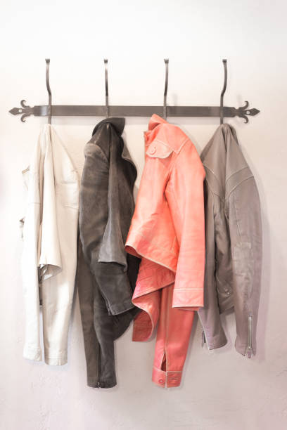istock Four Colorful Leather Jackets Hanging on Rack 1207423057