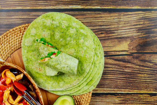 Spinach wrap with stir fry chicken and vegetable.