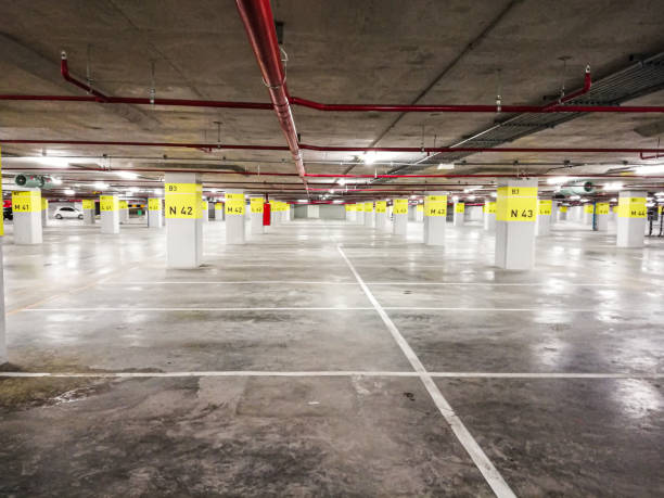 istock Empty space in car parking garage/building. 1207423184
