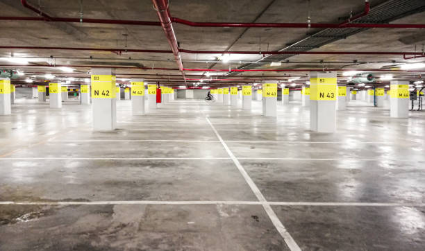 istock Empty space in car parking garage/building. 1207423260