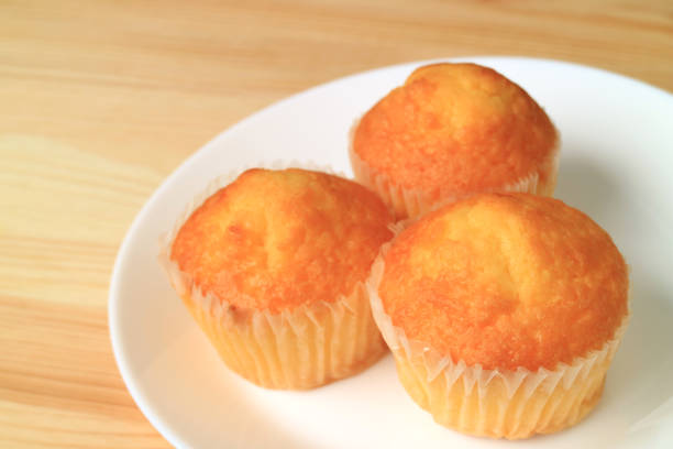 istock Plate of Madeleine Cupcakes Served on Wooden Table 1207423321