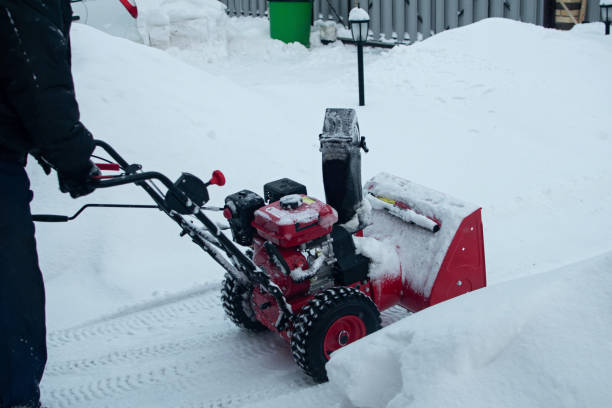 istock Snow clearing. Snowblower clears the way after heavy snowfall. 1207427337