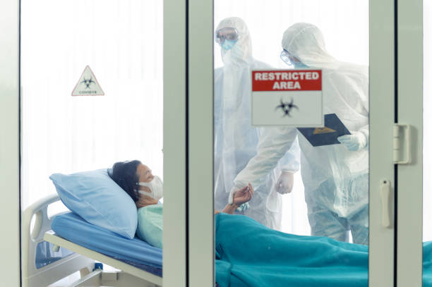istock Doctor examines corona or covid-19 virus patient 1207429695