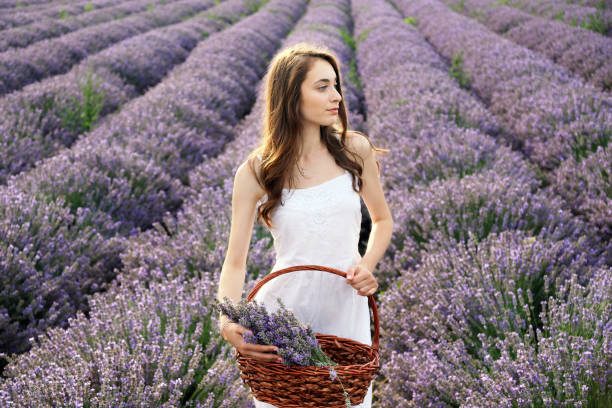 istock Young girl in lavender field 1207433401
