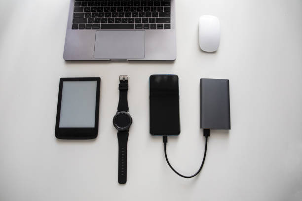 istock flatlay of different objects as laptop computer mouse phone smart watch e-book powerbank cellphone 1207434285
