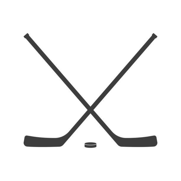 Ice hockey crossed sticks and puck icon Black silhouette isolated on white background. Sport equipment symbol. Vector illustration. Ice hockey crossed sticks and puck icon Black silhouette isolated on white background. Sport equipment symbol. Vector illustration. cross match stock illustrations