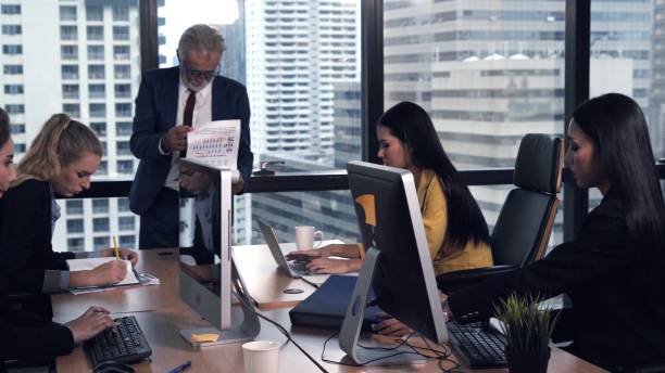 istock Senior leader giving advice speech to team members 1207437832