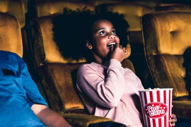 istock Three children having fun watching movie 1207438065