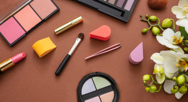 istock Make up cosmetics products against brown color background 1207439306