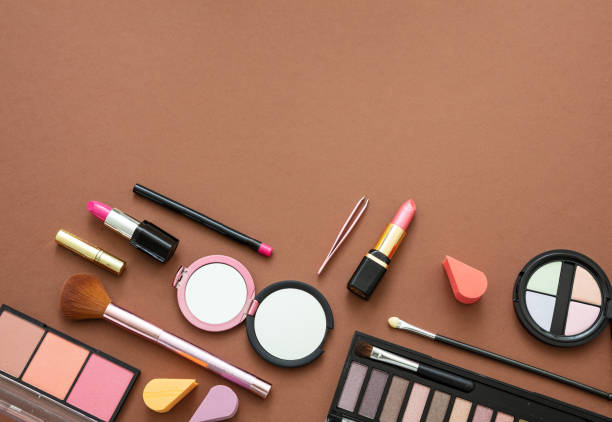 istock Make up cosmetics products against brown color background 1207439316